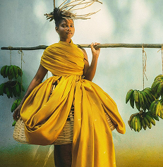 Woman in yellow dress with bananas